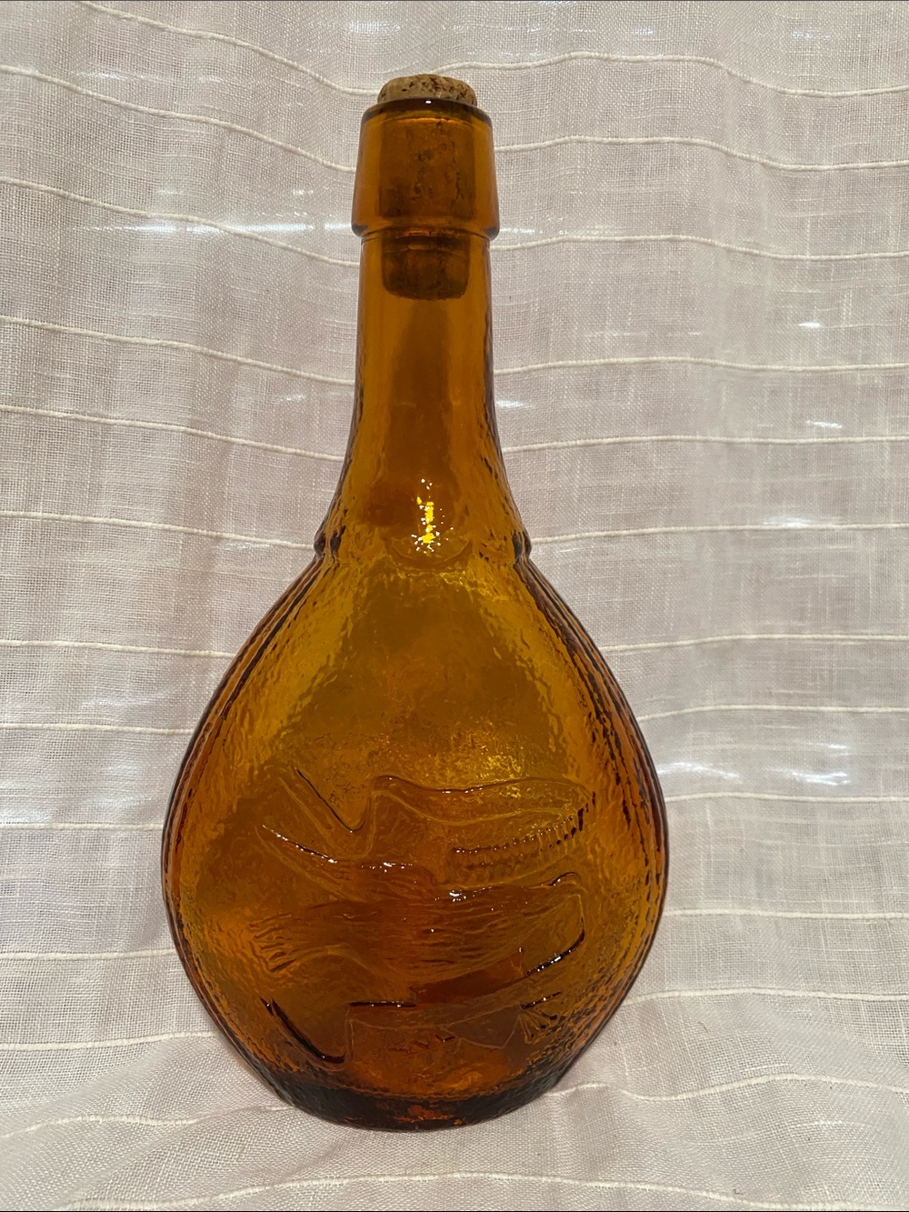 Vintage Amber Glass Bottle with Embossed Bird Motif